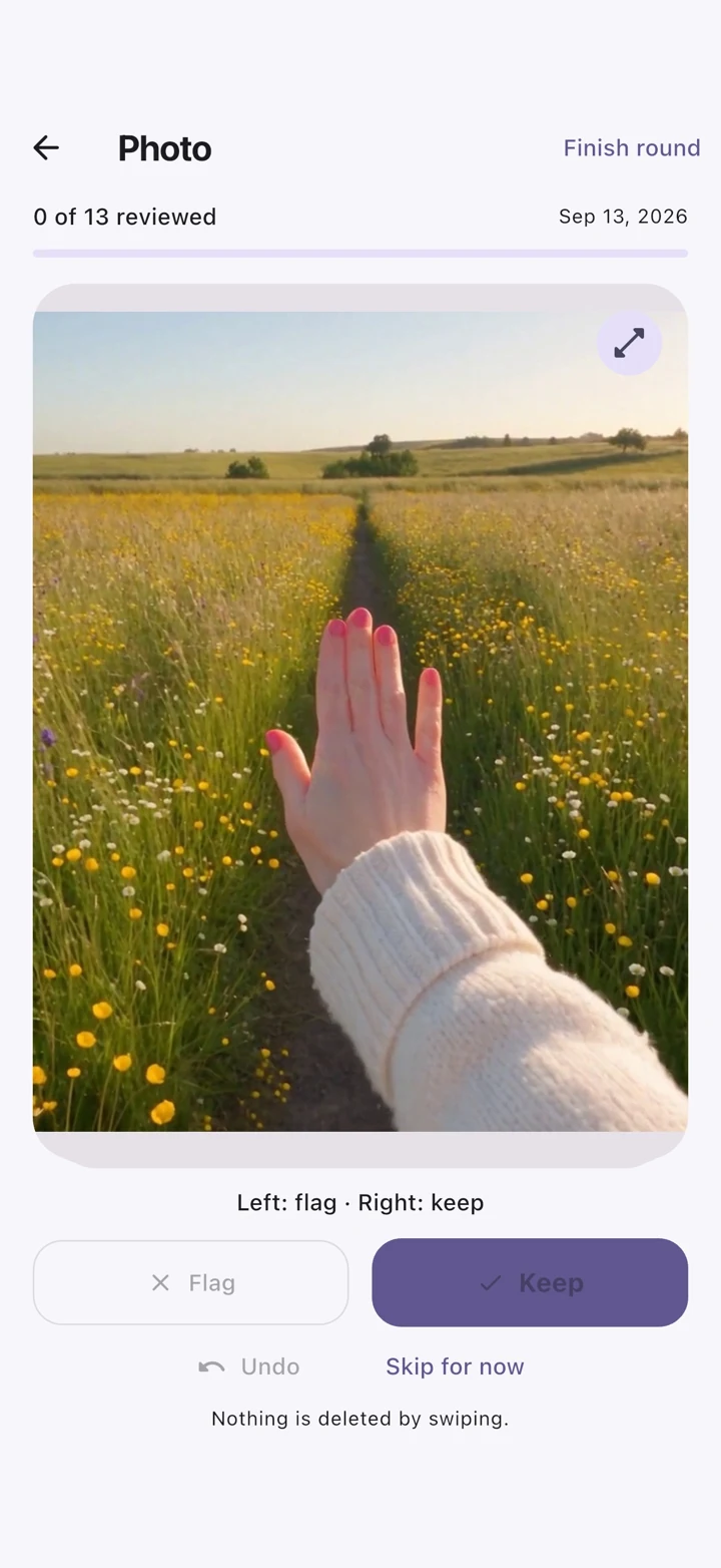 SwipeSort iPhone: Photo review showing a hand over a meadow